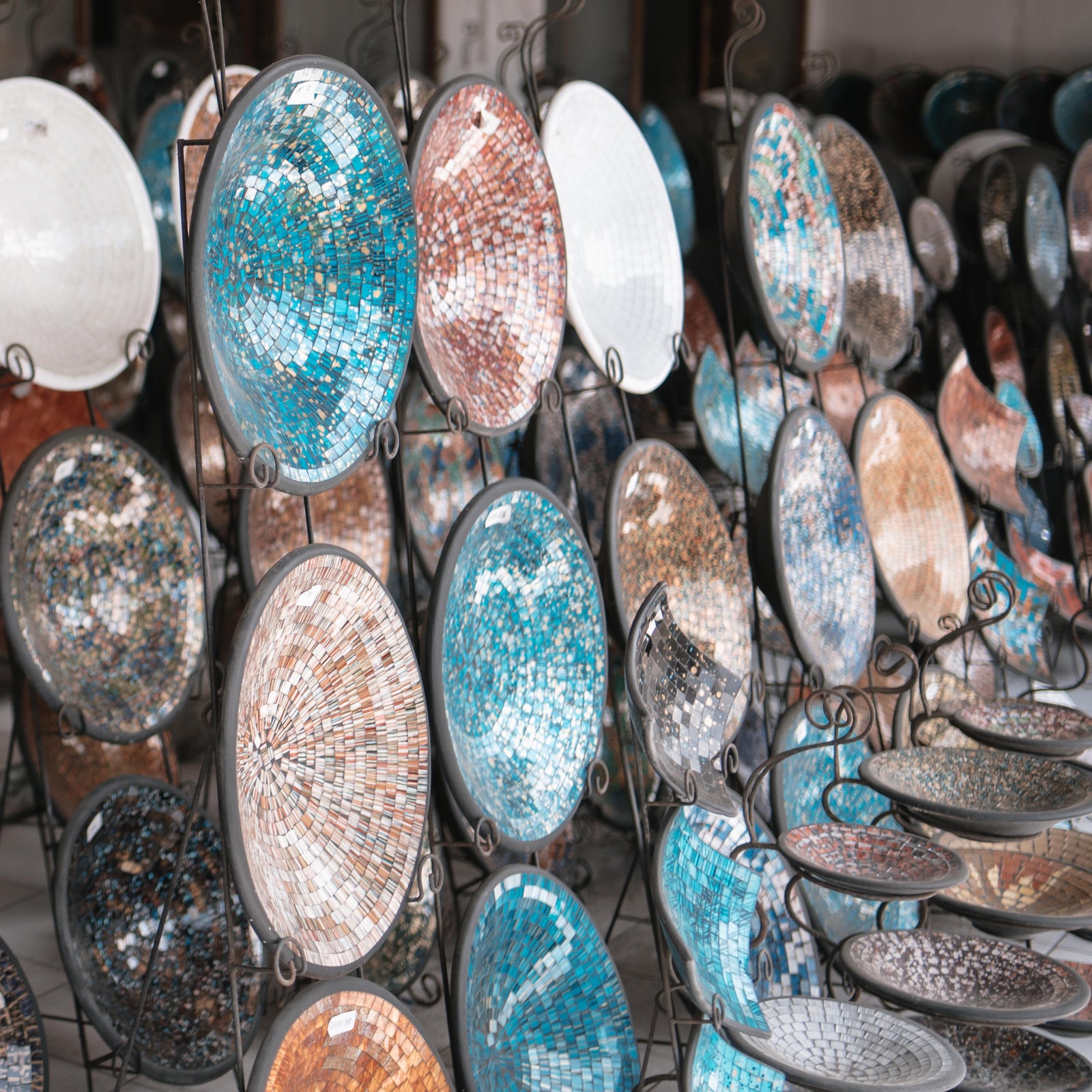 tiled mosaic plates on display in front of shop