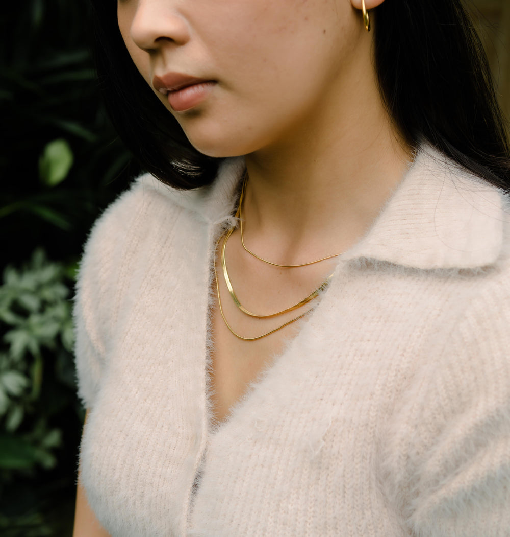 Colliers de pierres précieuses superposées