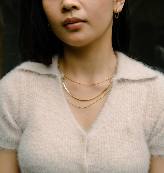 Colliers de pierres précieuses superposées