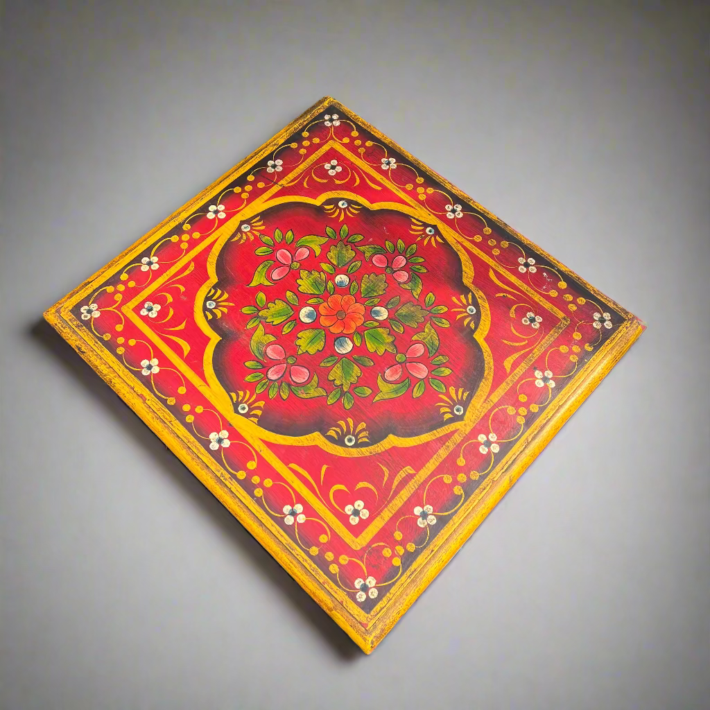 Painted tabletop with floral design on a white background