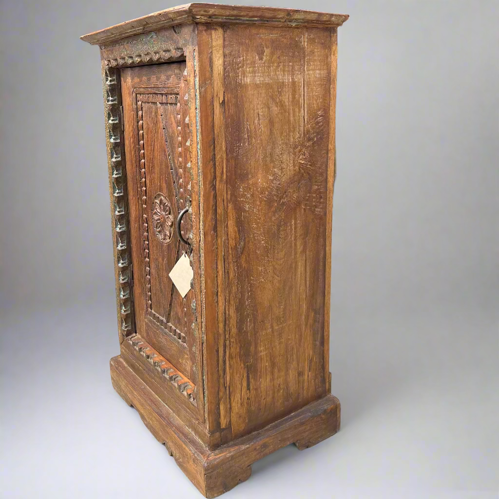 Wooden cabinet with intricate carvings