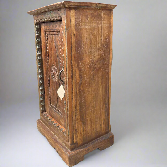 Wooden cabinet with intricate carvings
