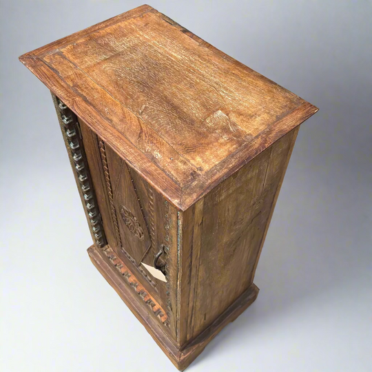 Wooden side table with decorative carvings