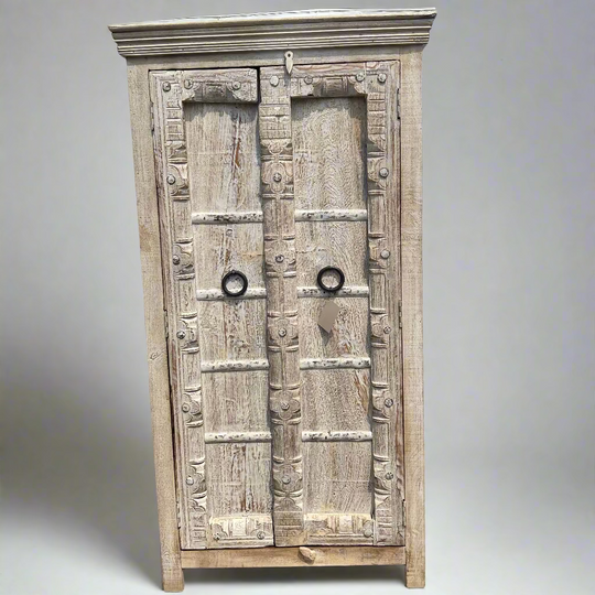 Wooden cabinet with decorative carvings