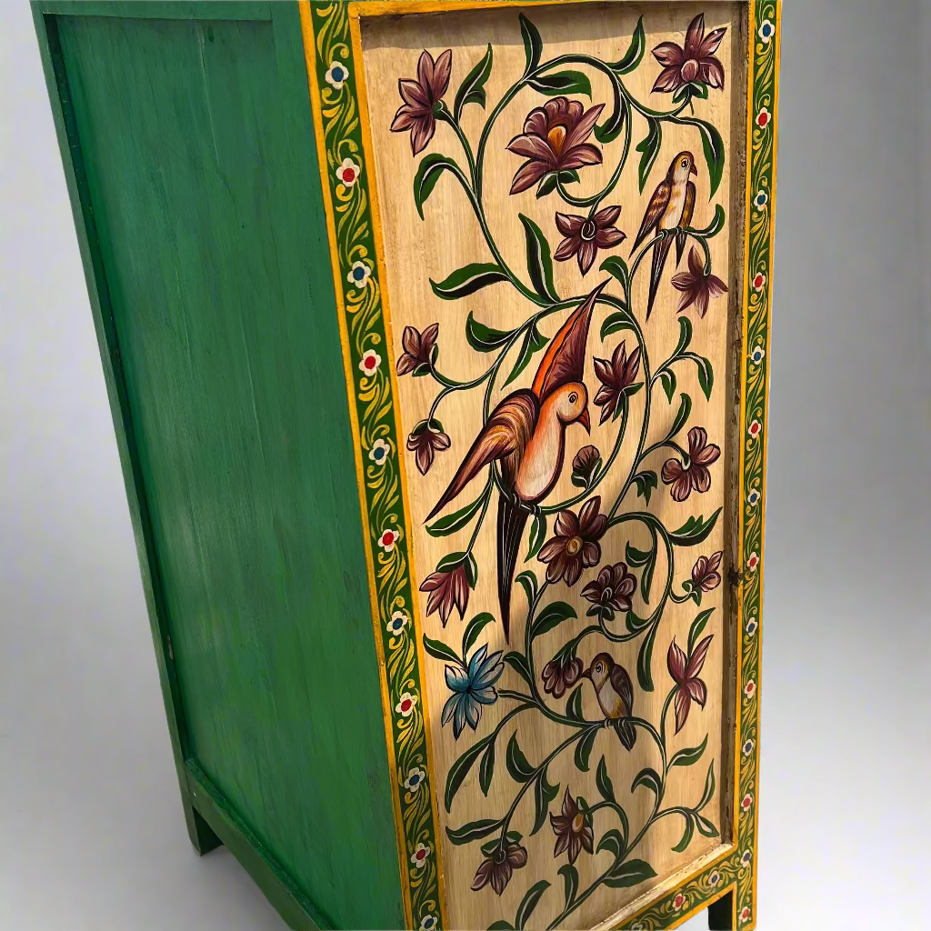 Decorative cabinet with floral and bird patterns on a green base.