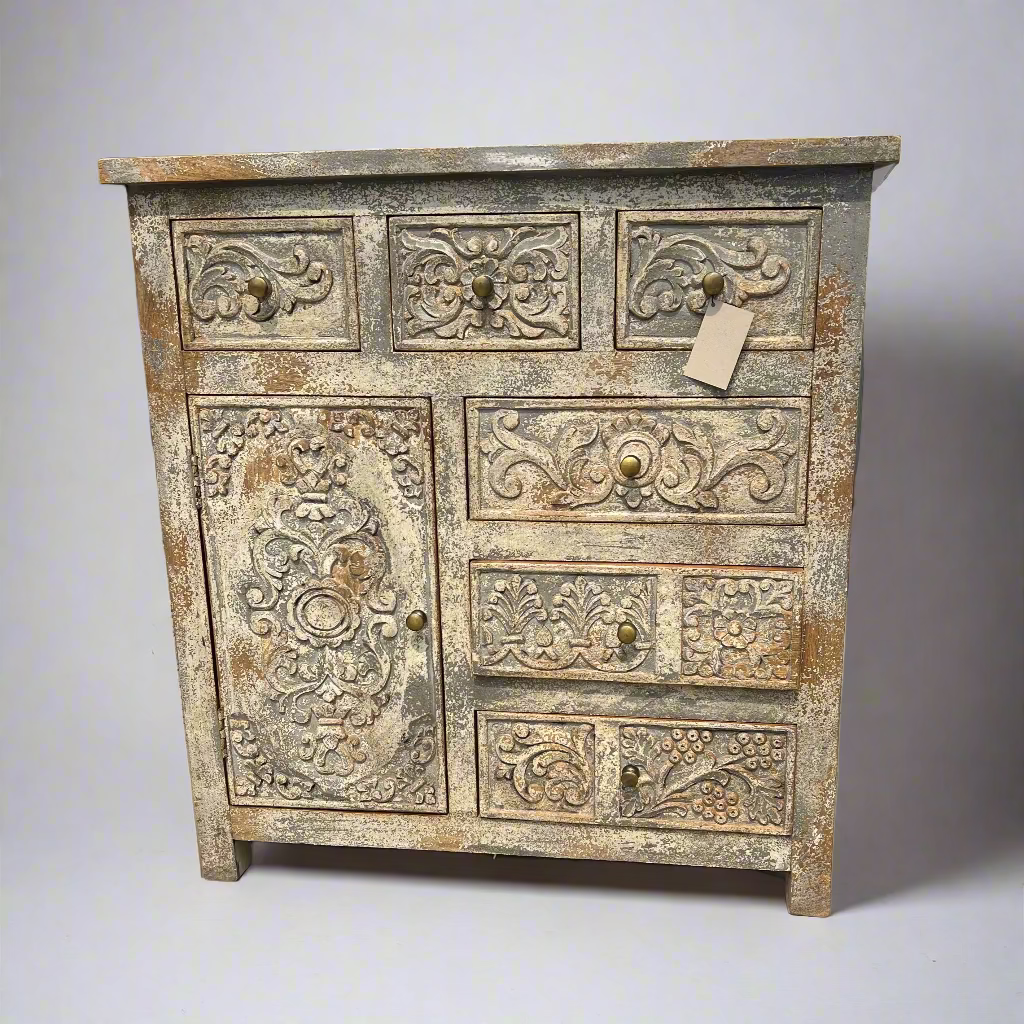 Antique wooden cabinet with intricate carvings