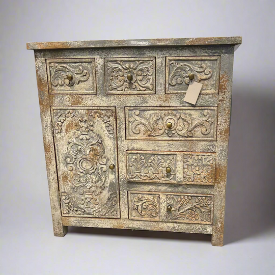 Antique wooden cabinet with intricate carvings