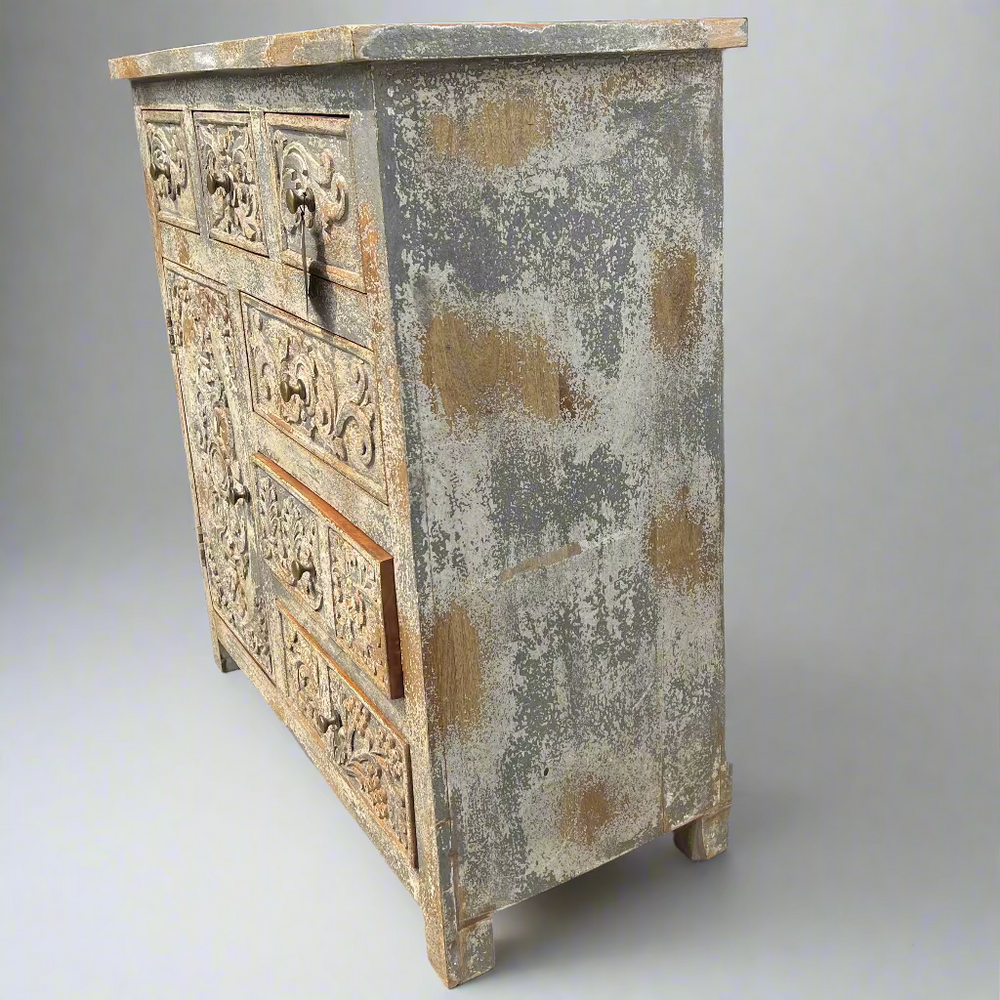 Vintage-style wooden cabinet with intricate carvings