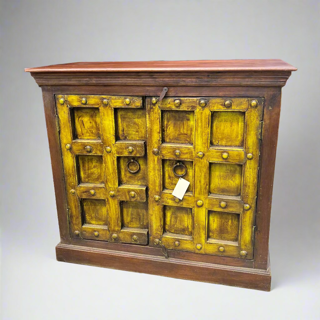 Wooden cabinet with yellowish-green doors and brown frame