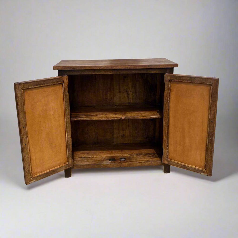 Wooden cabinet with open doors on a concrete