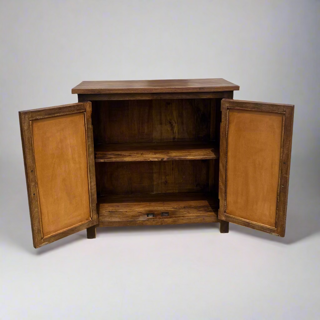 Wooden cabinet with open doors on a concrete