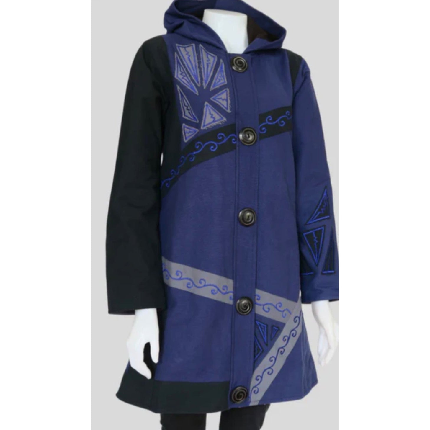 Blue coat with black accents on a mannequin against a white background