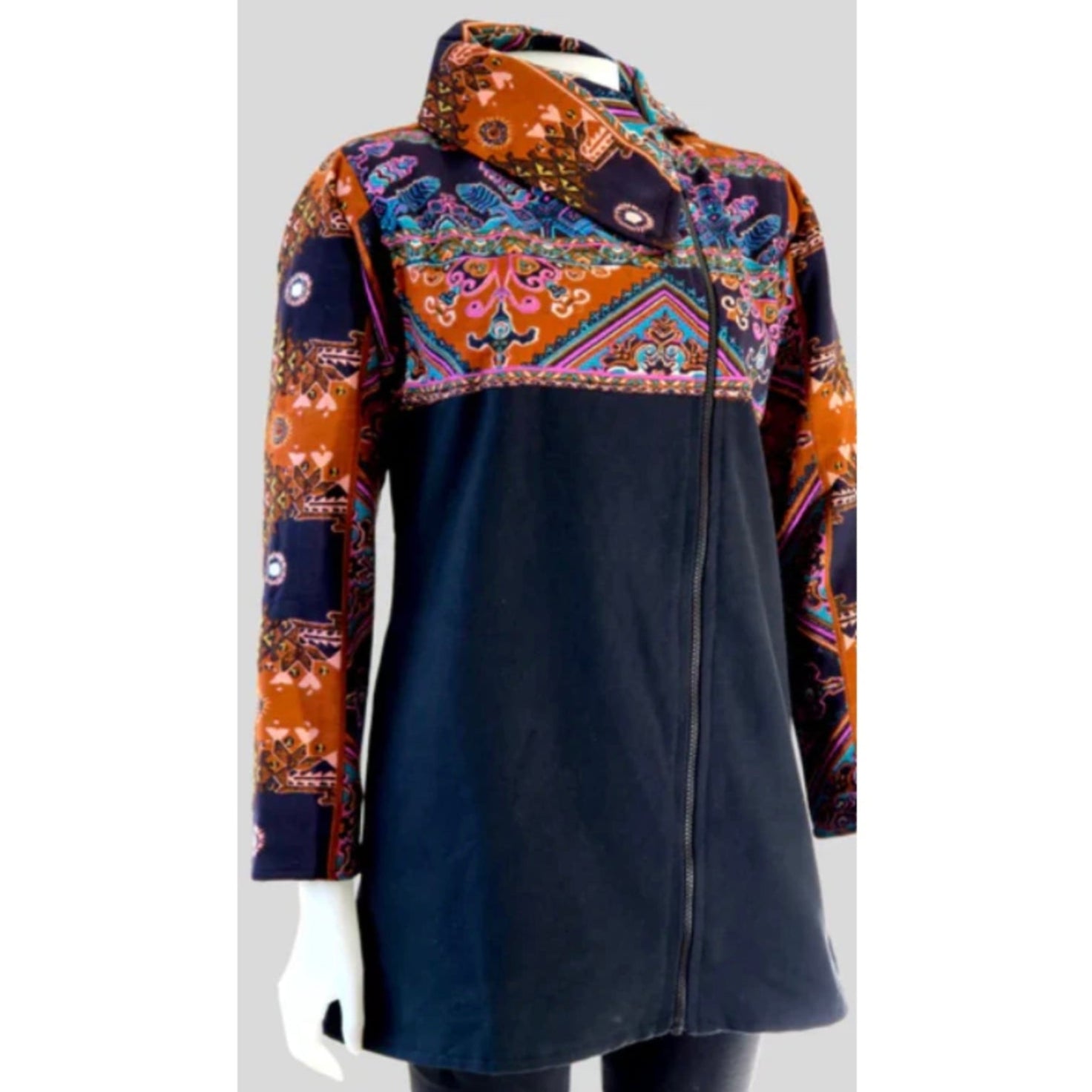 Colorful patterned shirt on a mannequin against a white background