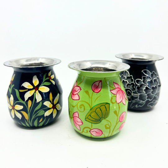 Three stainless steel mini water pots, each hand-painted with traditional Rajasthani-style floral patterns, displayed on a white background.