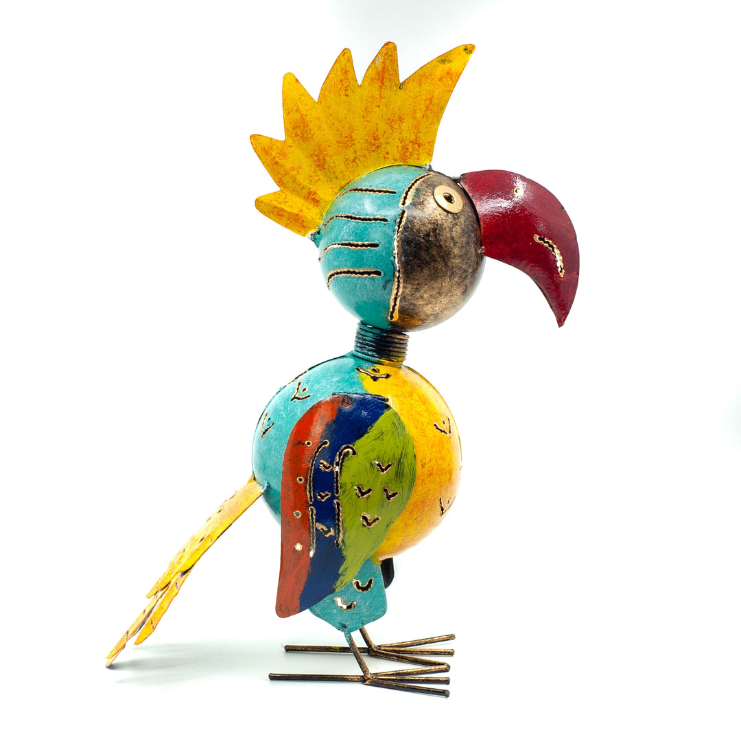 Metal cockatoo style bird in bright colours mostly yellow on white background
