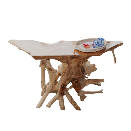 An image of a Balinese Teak Root Console. The table is expertly crafted from reclaimed teak roots, preserving their natural shapes and textures. The intricate and gnarled root structure creates a visually captivating display, while the smooth, finished surface adds a touch of refinement. It brings a sense of nature-inspired elegance to any entryway, hallway, or living space, making a statement of distinctive style.