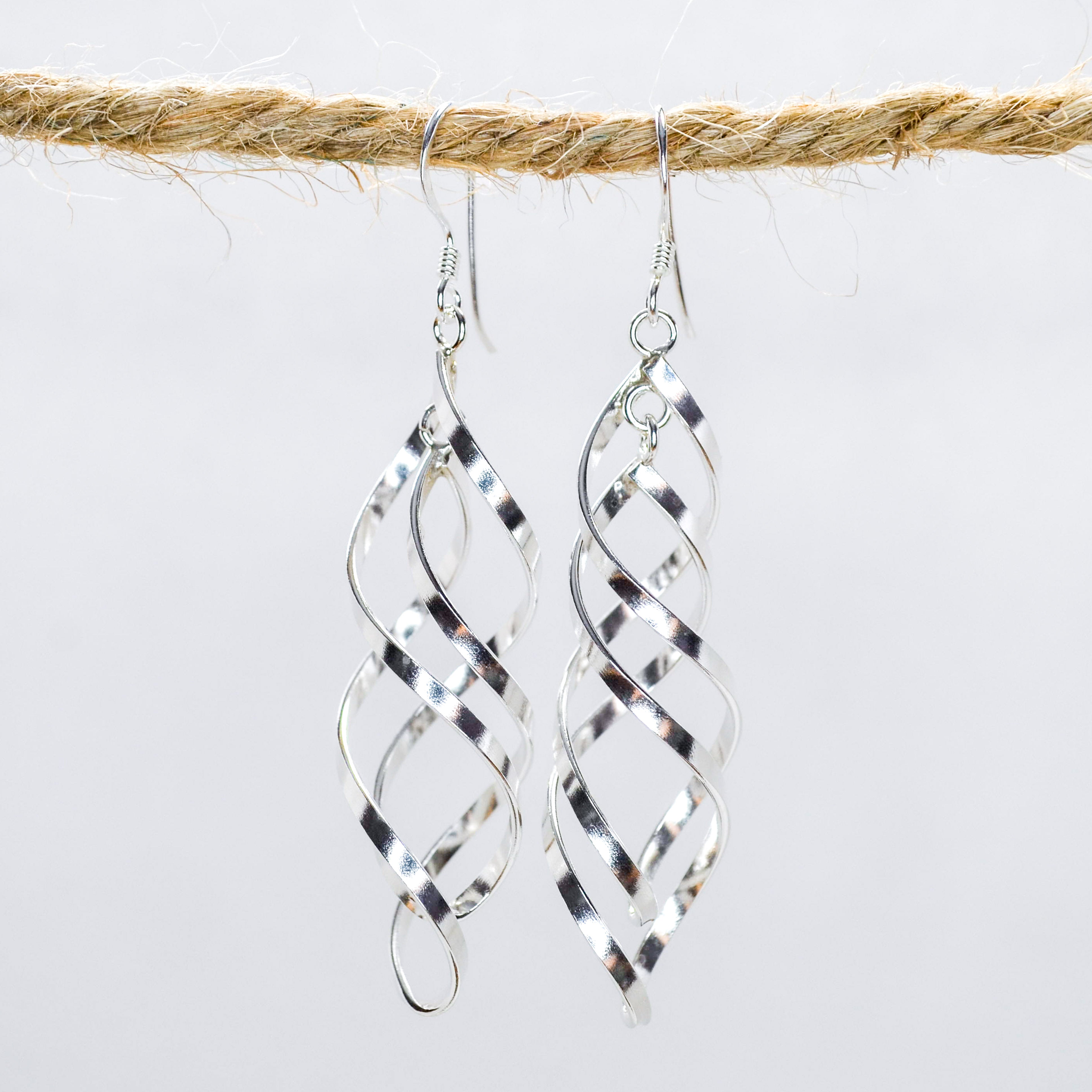 Silver Swirling sculpture dangling earrings