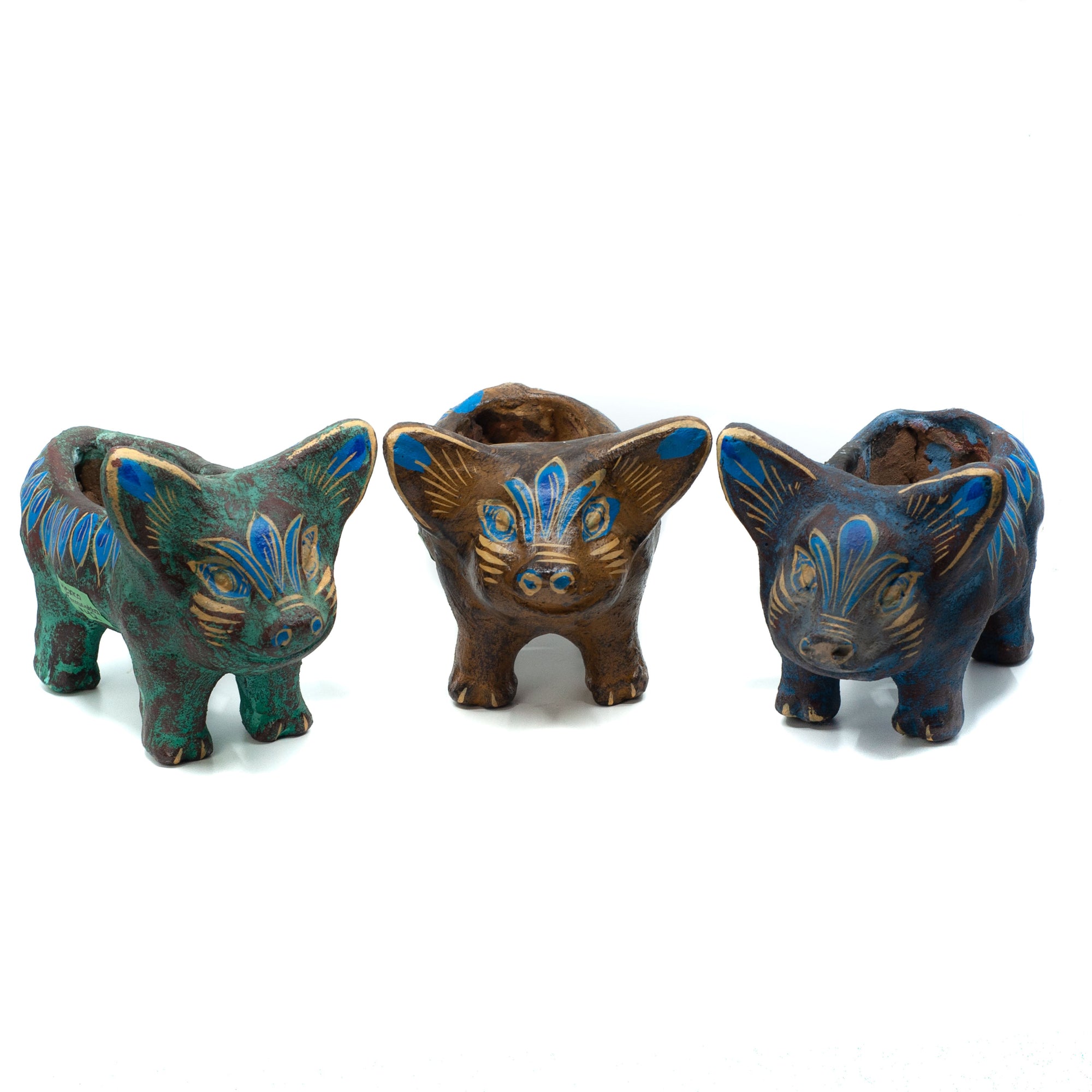 Photo of small terracotta pig plant holder with hand-painted designs