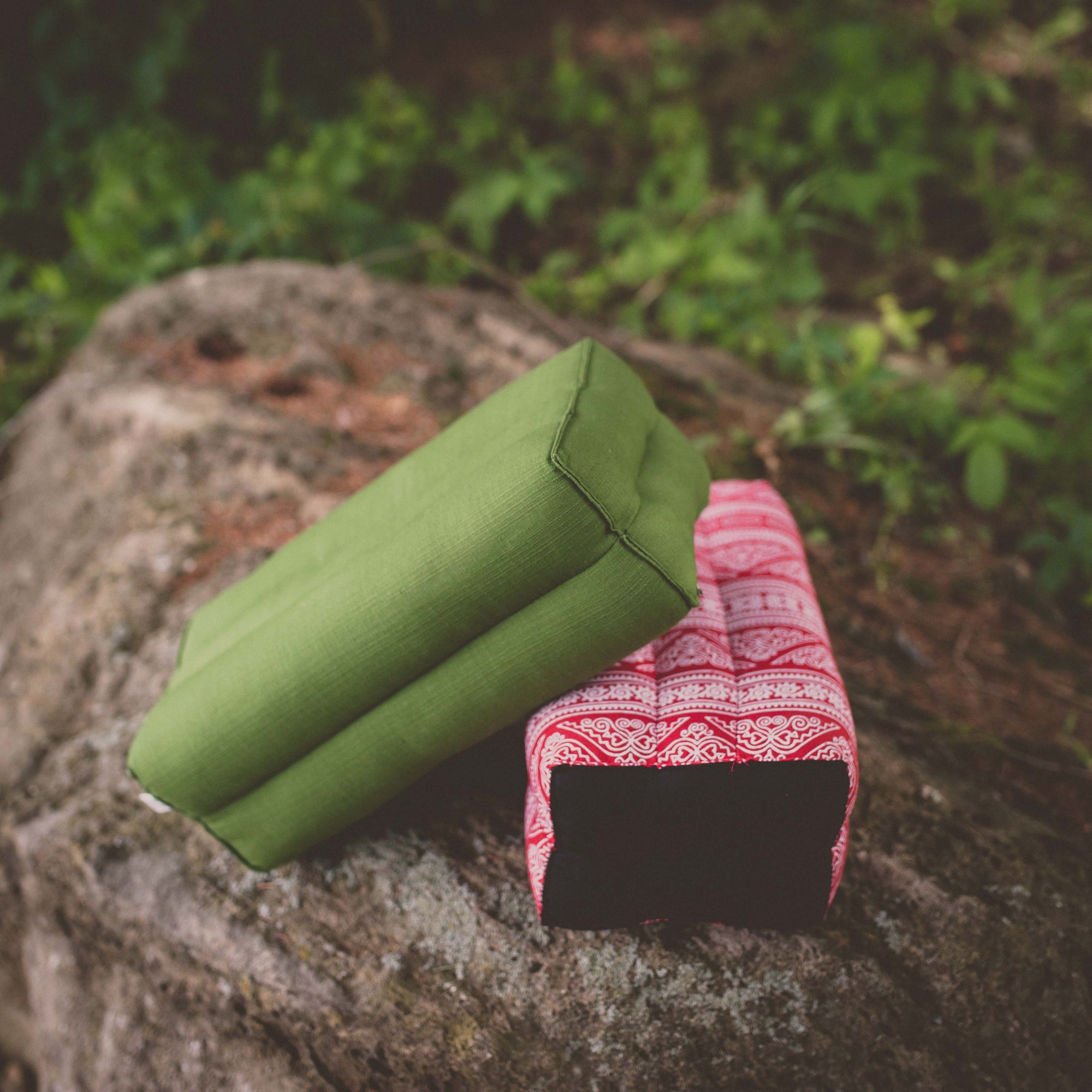 Photo of green and red yoga support cushions