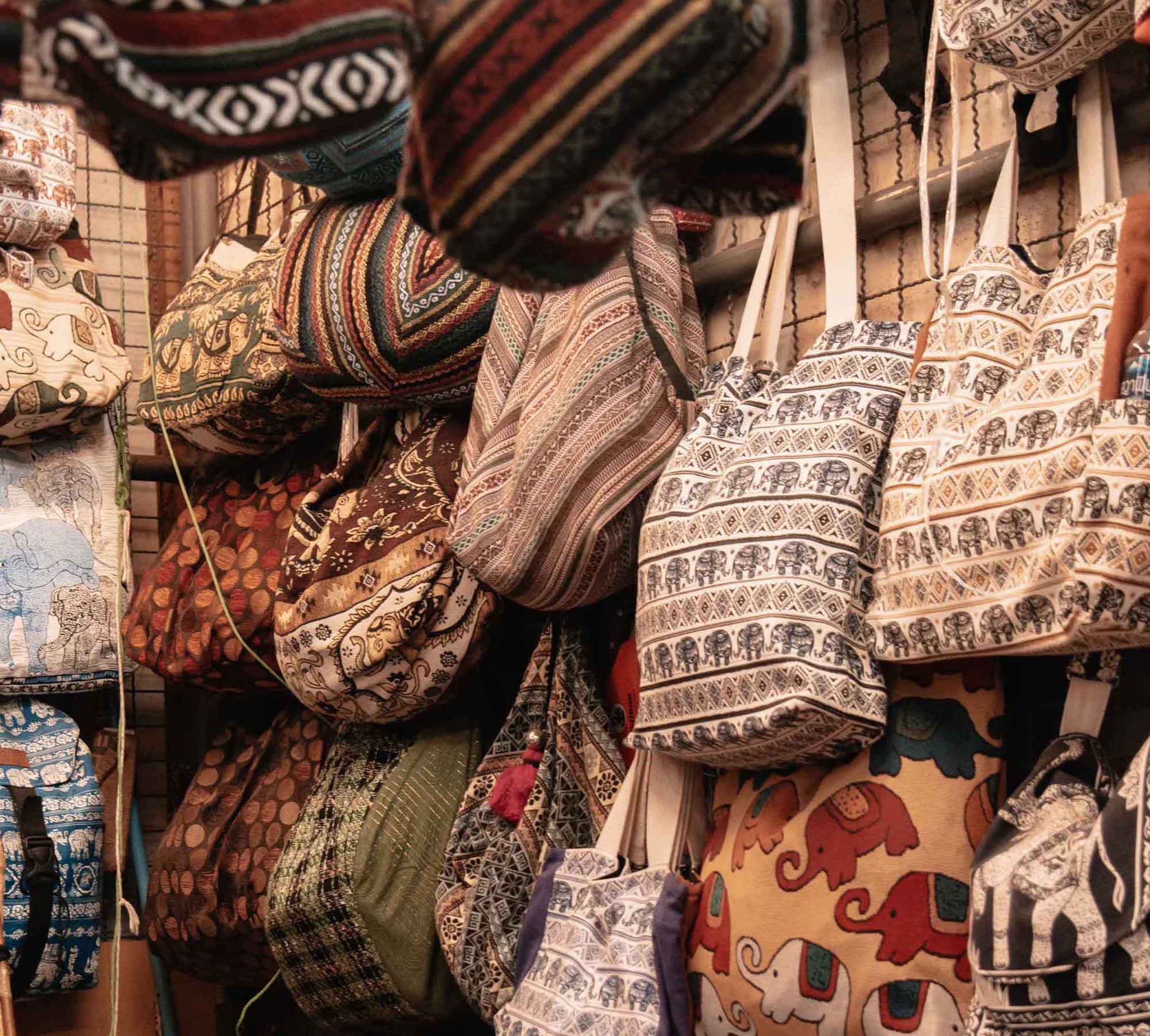 Bags on the wall in market stall in Thailand