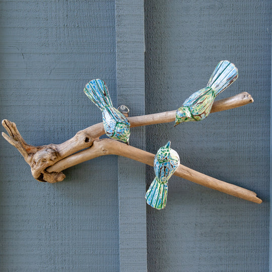Three Green Birds on Driftwood