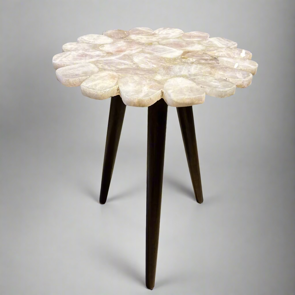 Small round table with a unique white surface design 