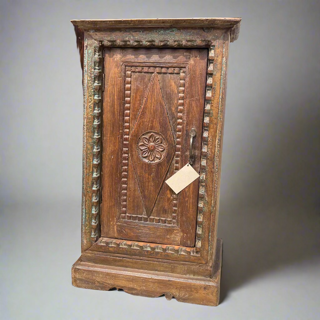 Wooden cabinet with intricate carvings 