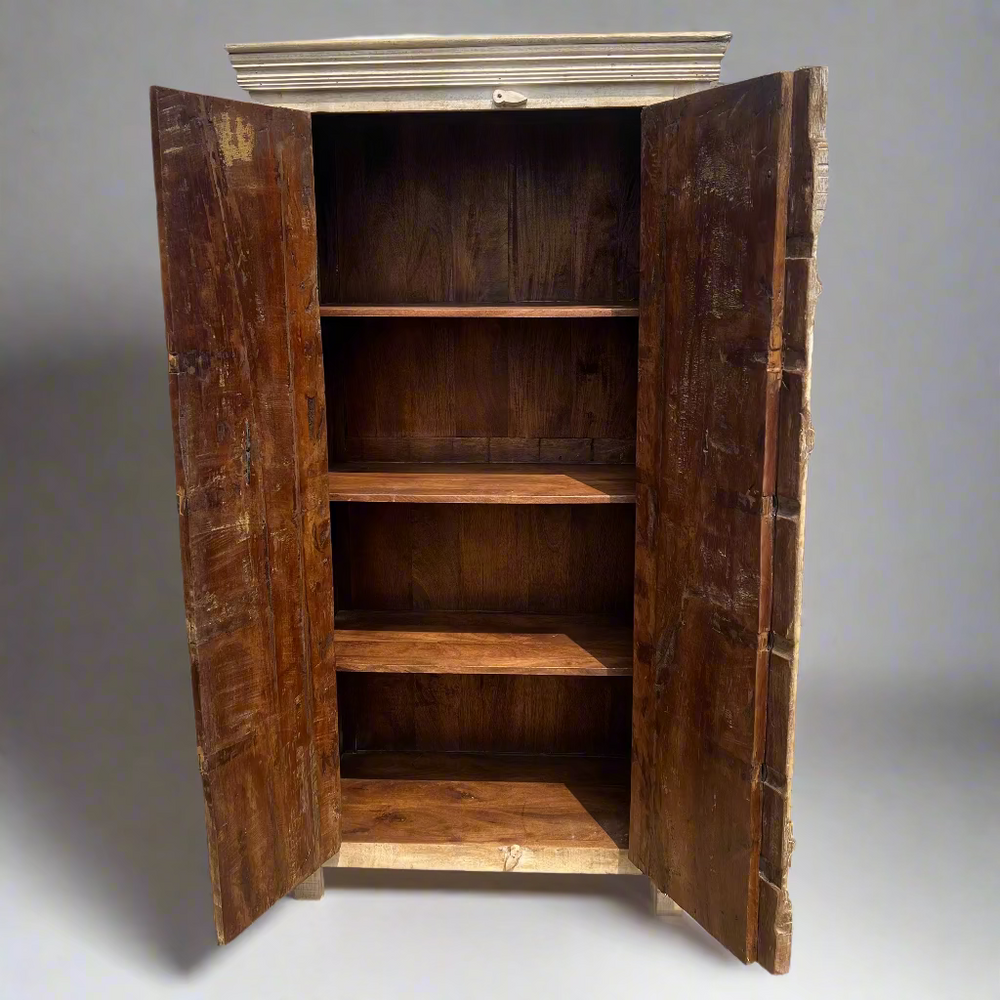 Wooden wardrobe with open doors in front 