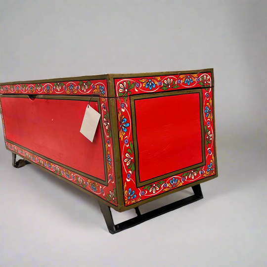 Decorative red chest with colorful patterns 