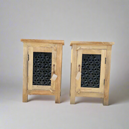 Two wooden cabinets with decorative metal grilles 