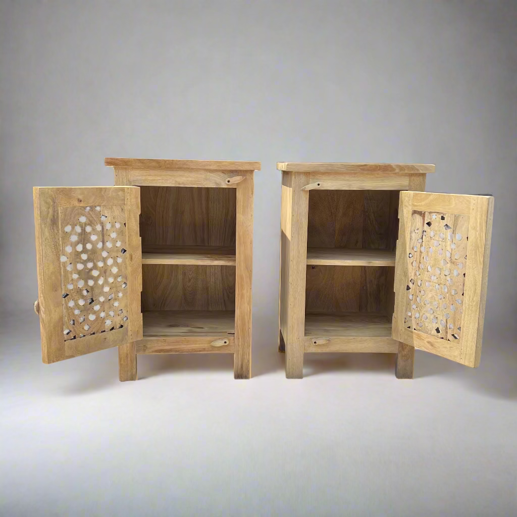 Two wooden cabinets with decorative latticework doors 