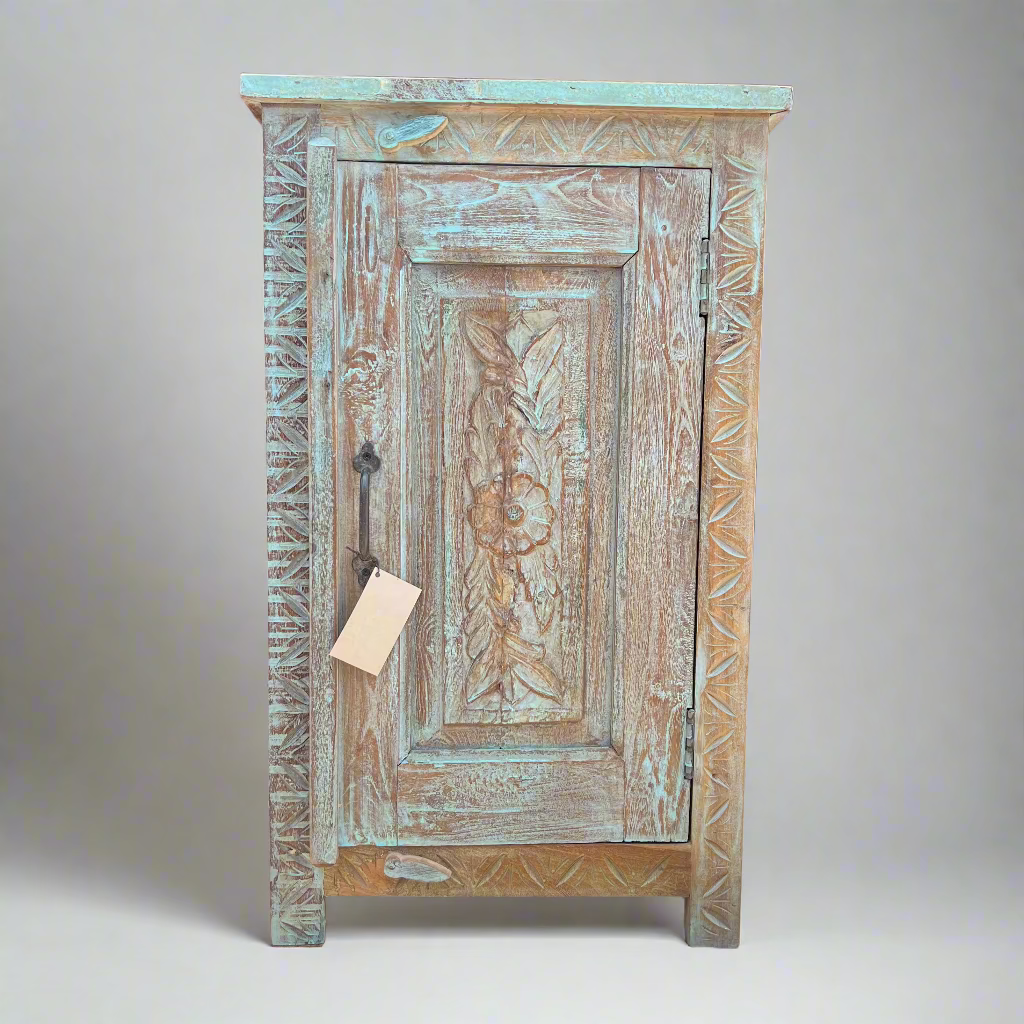 Vintage wooden cabinet with intricate carvings 