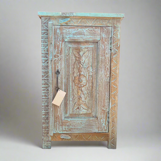 Vintage wooden cabinet with intricate carvings 