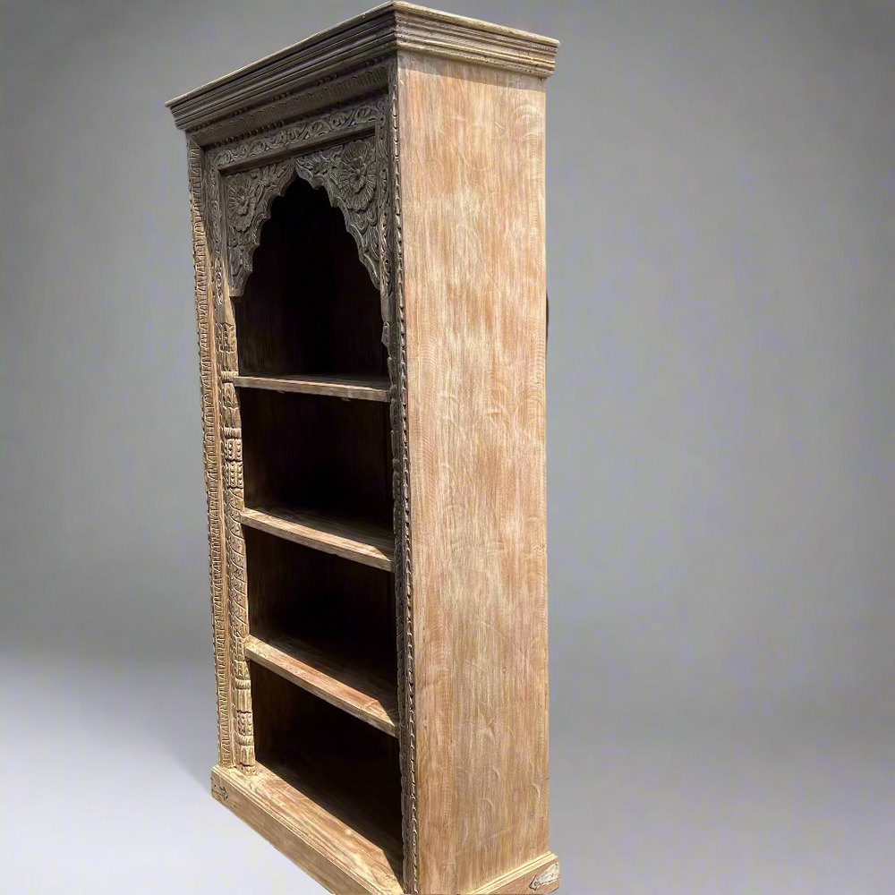 Tall wooden bookshelf with intricate carvings 
