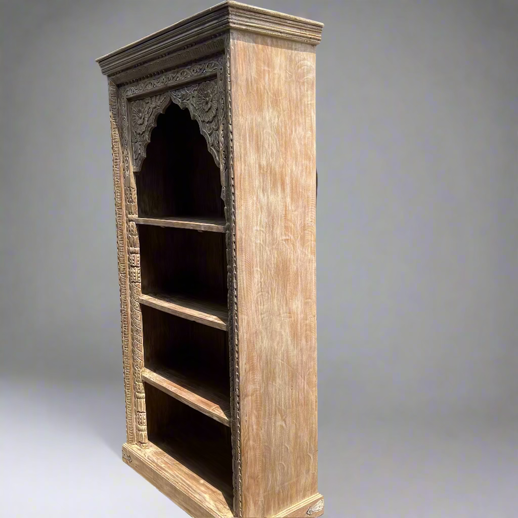 Tall wooden bookshelf with intricate carvings 
