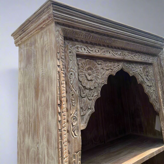 Wooden archway with intricate carvings 