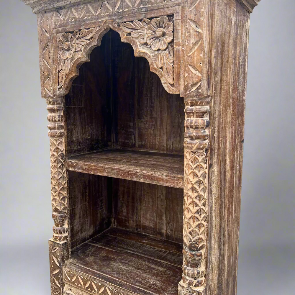 Carved wooden shelf with intricate patterns 
