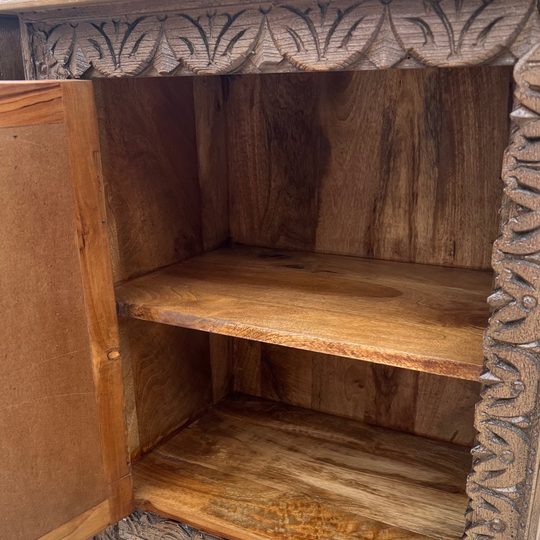 Wooden cabinet with intricate carvings 