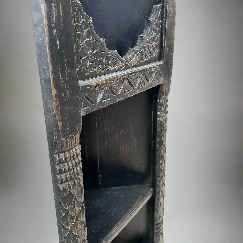 Decorative wooden shelf with intricate carvings 