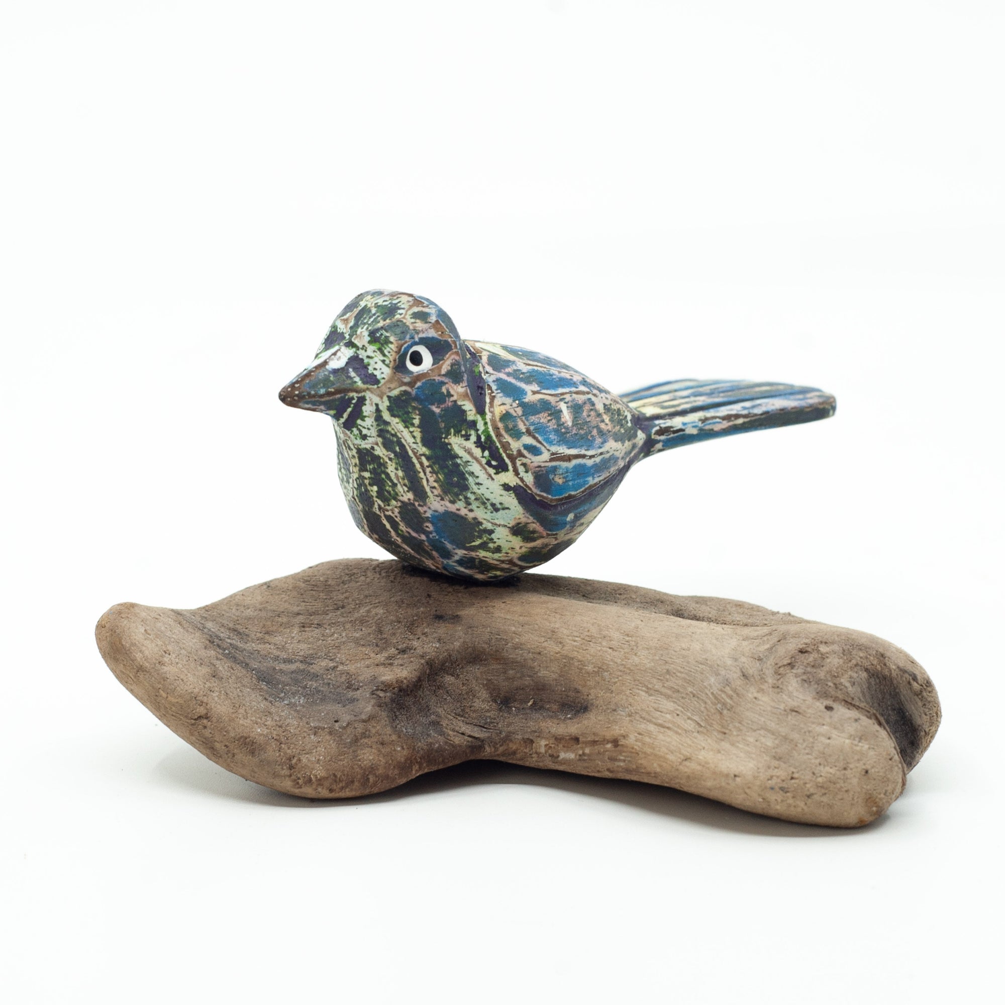 Small driftwood bird or on white background on wooden base. 