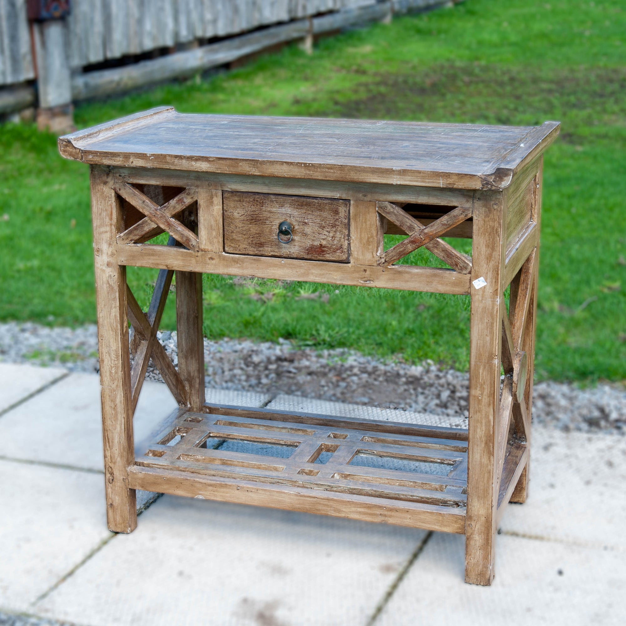 Olive grayish wooden console table with a single drawer in the middle