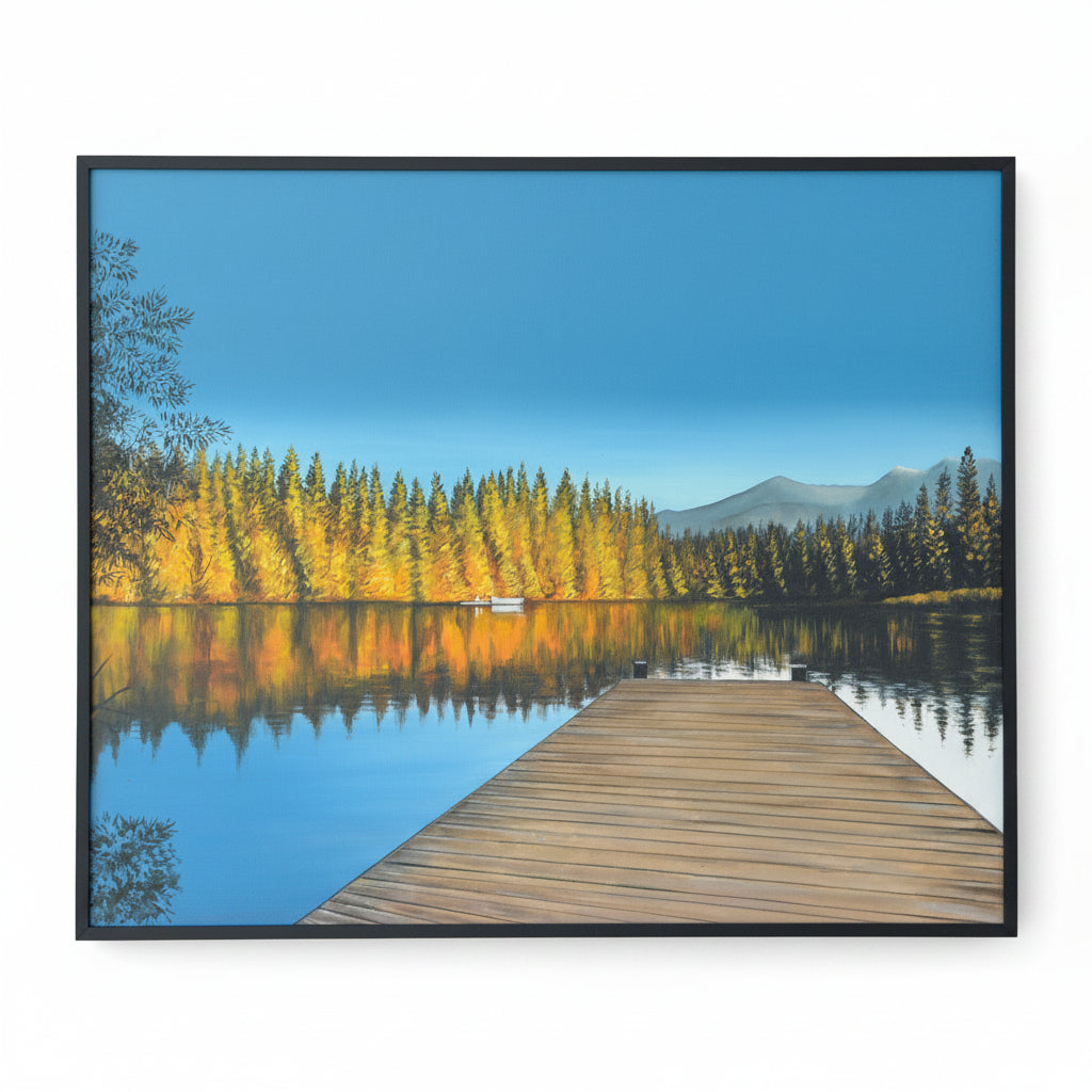 Dock looking out onto a calm lake and fall landscape