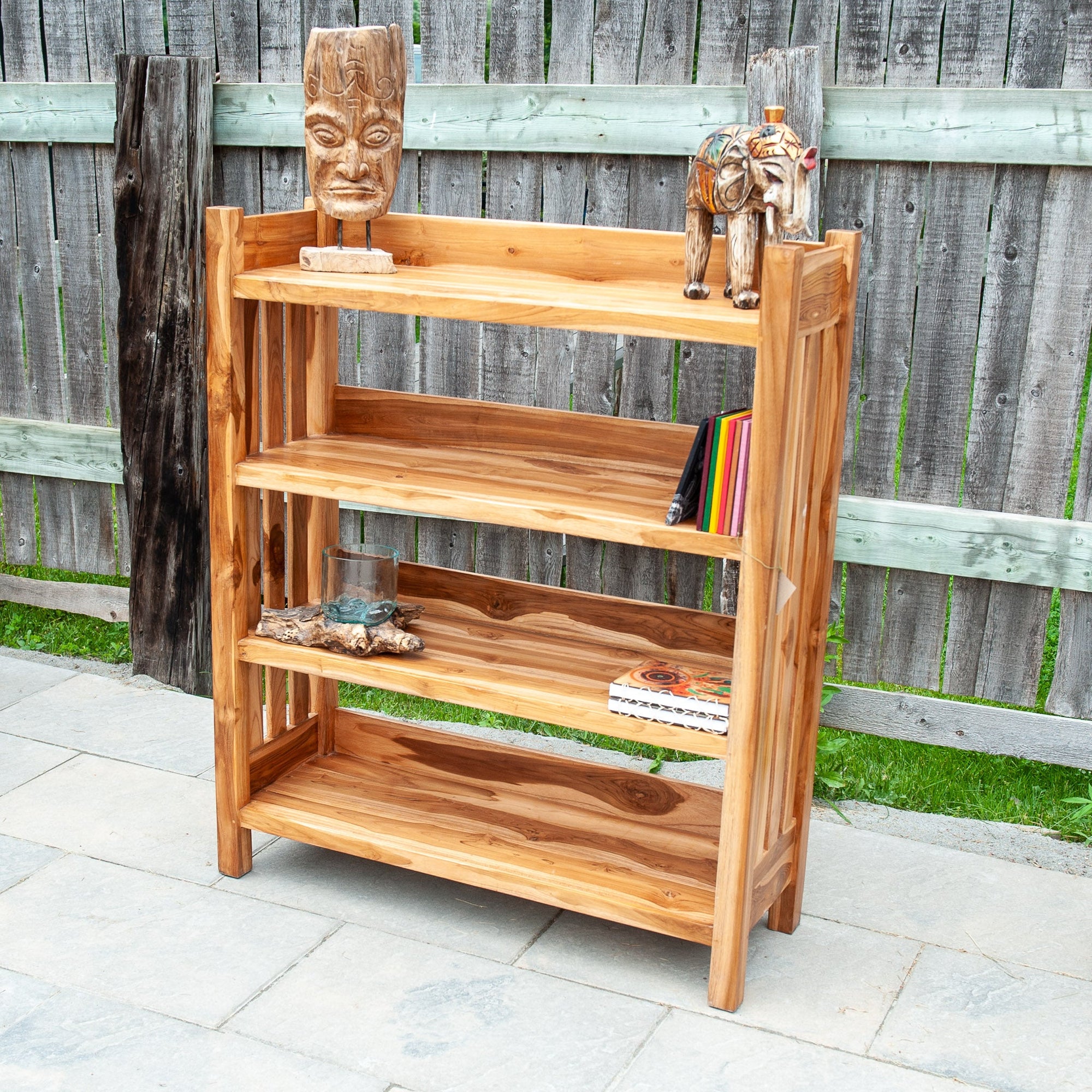 An image of an Indonesian Teak Classic Bookcase. This bookcase embodies timeless elegance and craftsmanship. Made from Indonesian teak wood, the bookcase features a sturdy construction and a rich, lustrous finish.
