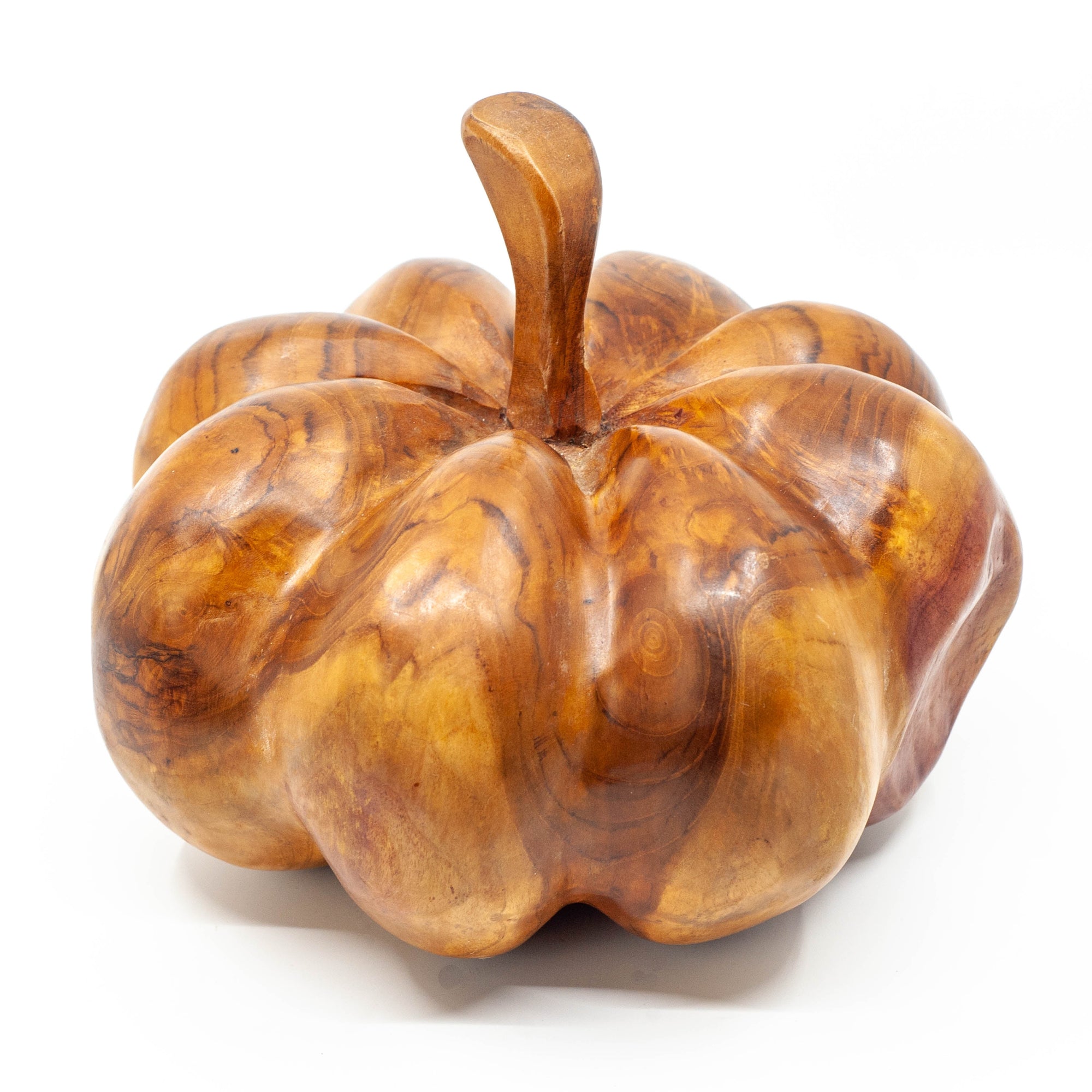 Wooden carved pumpkin on white background