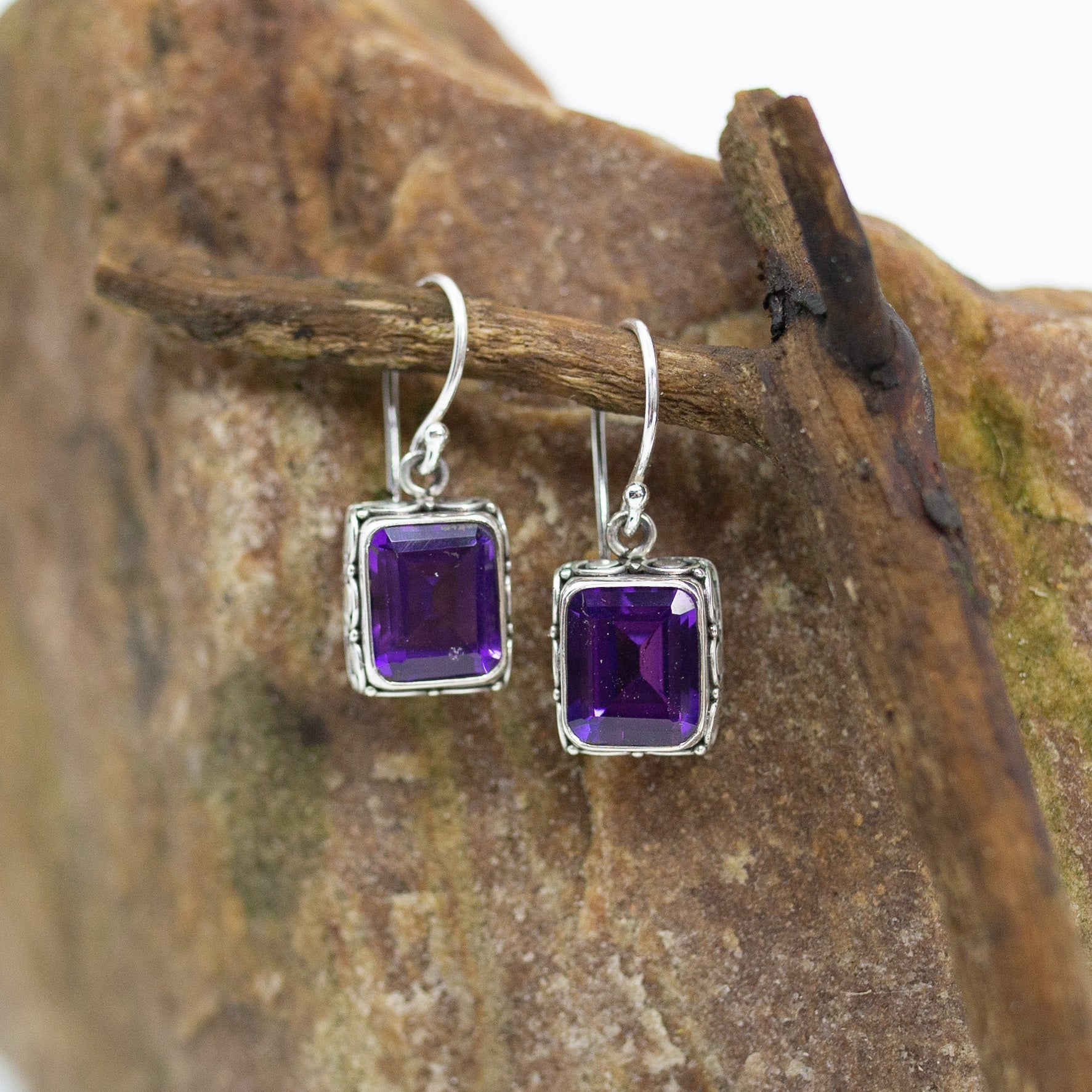 Bali Amethyst Square Pendant Dangle Earrings on wood
