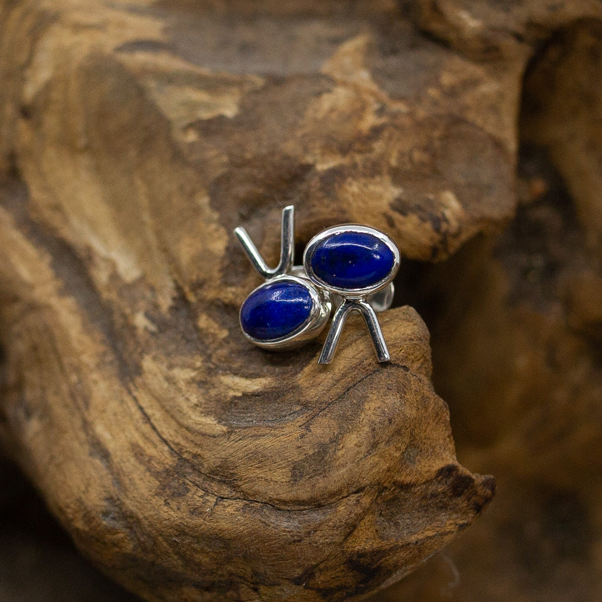 Bali Eyelash Lapis Lazuli Stud Earrings on wood