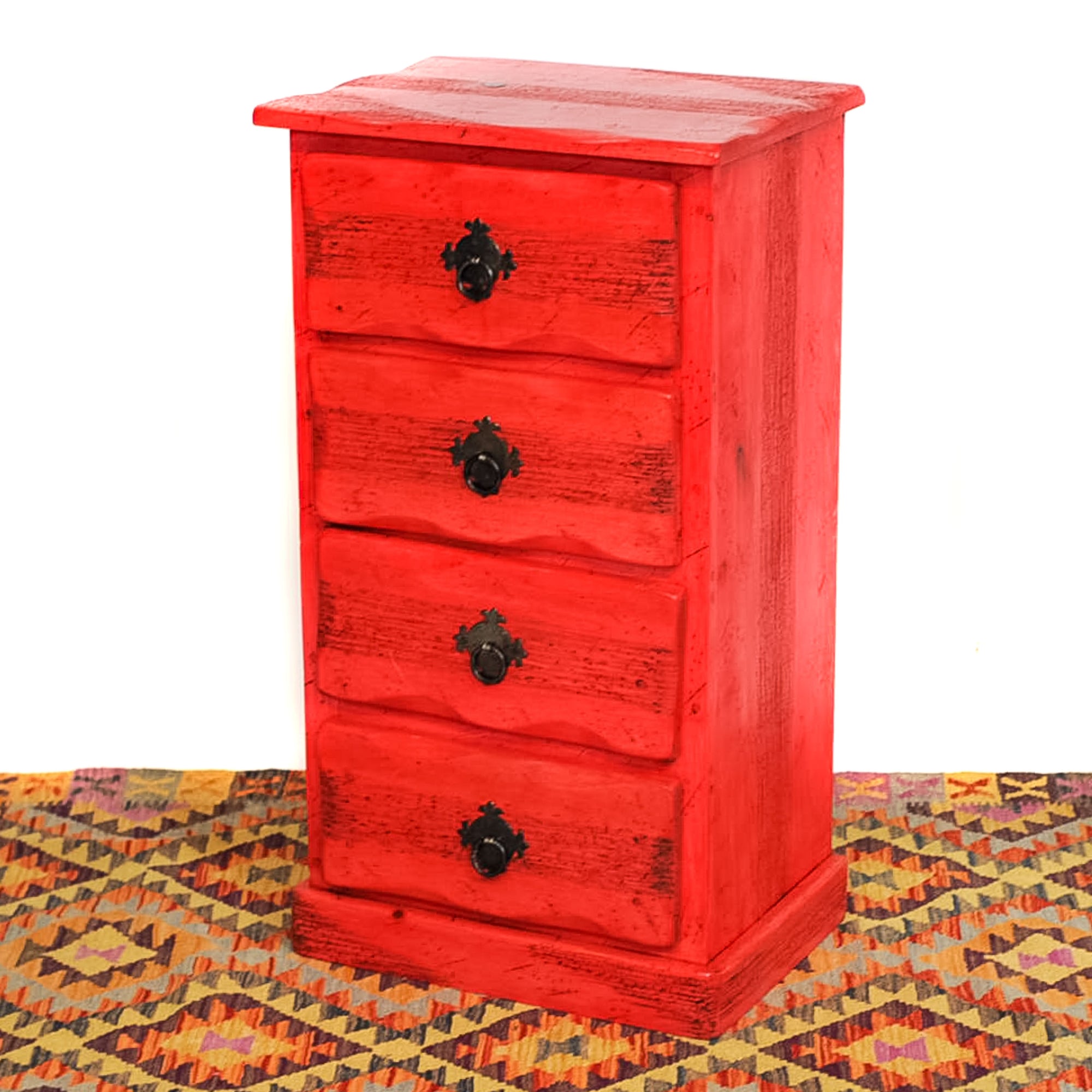 Photo of 4 drawer small mexican dresser in red.