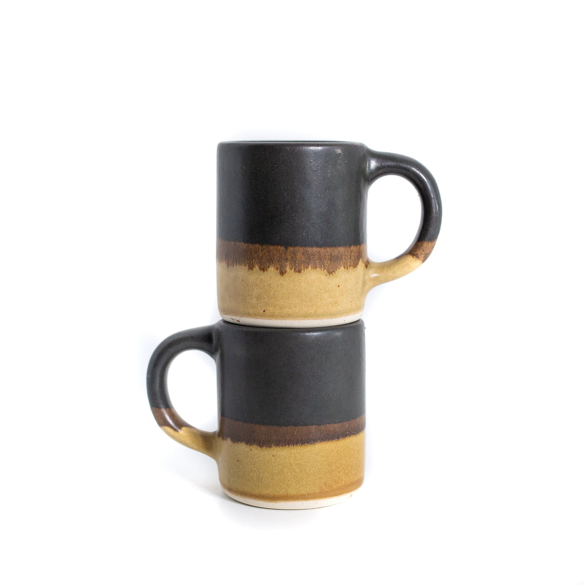 stacked multi colour coffee mugs
