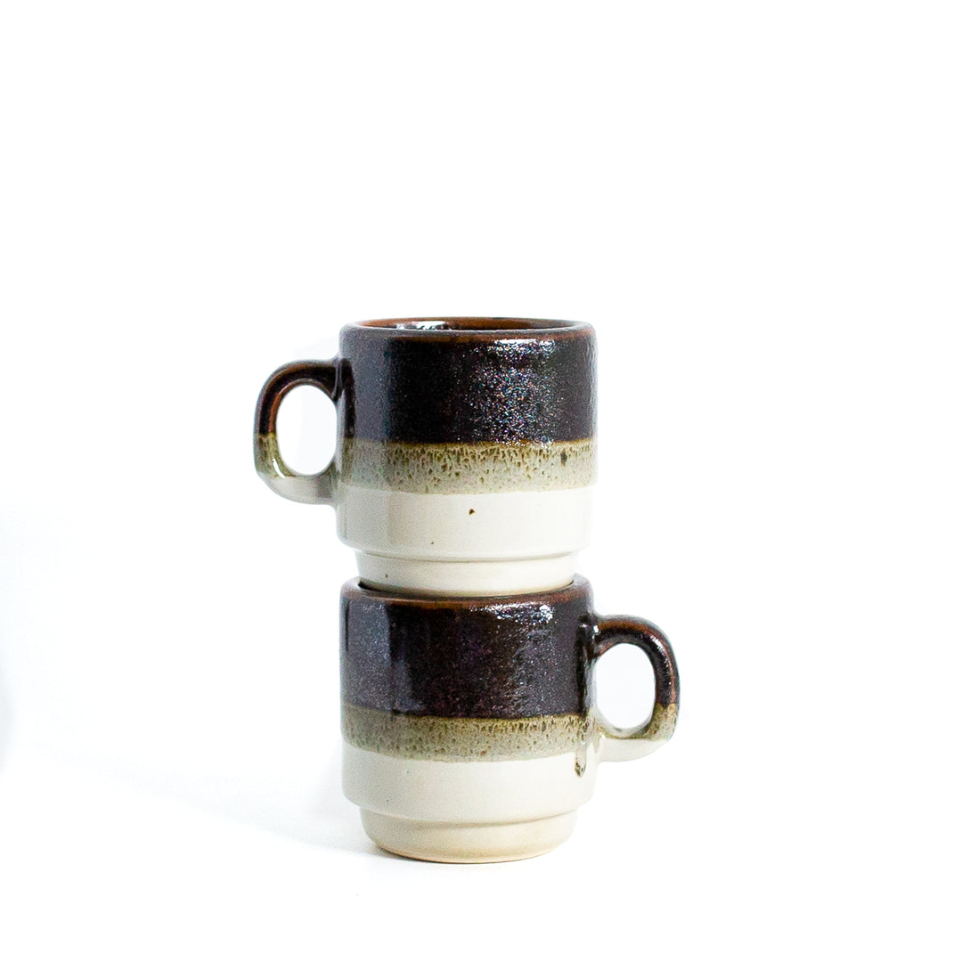 Tri-colour coffee mug on white background