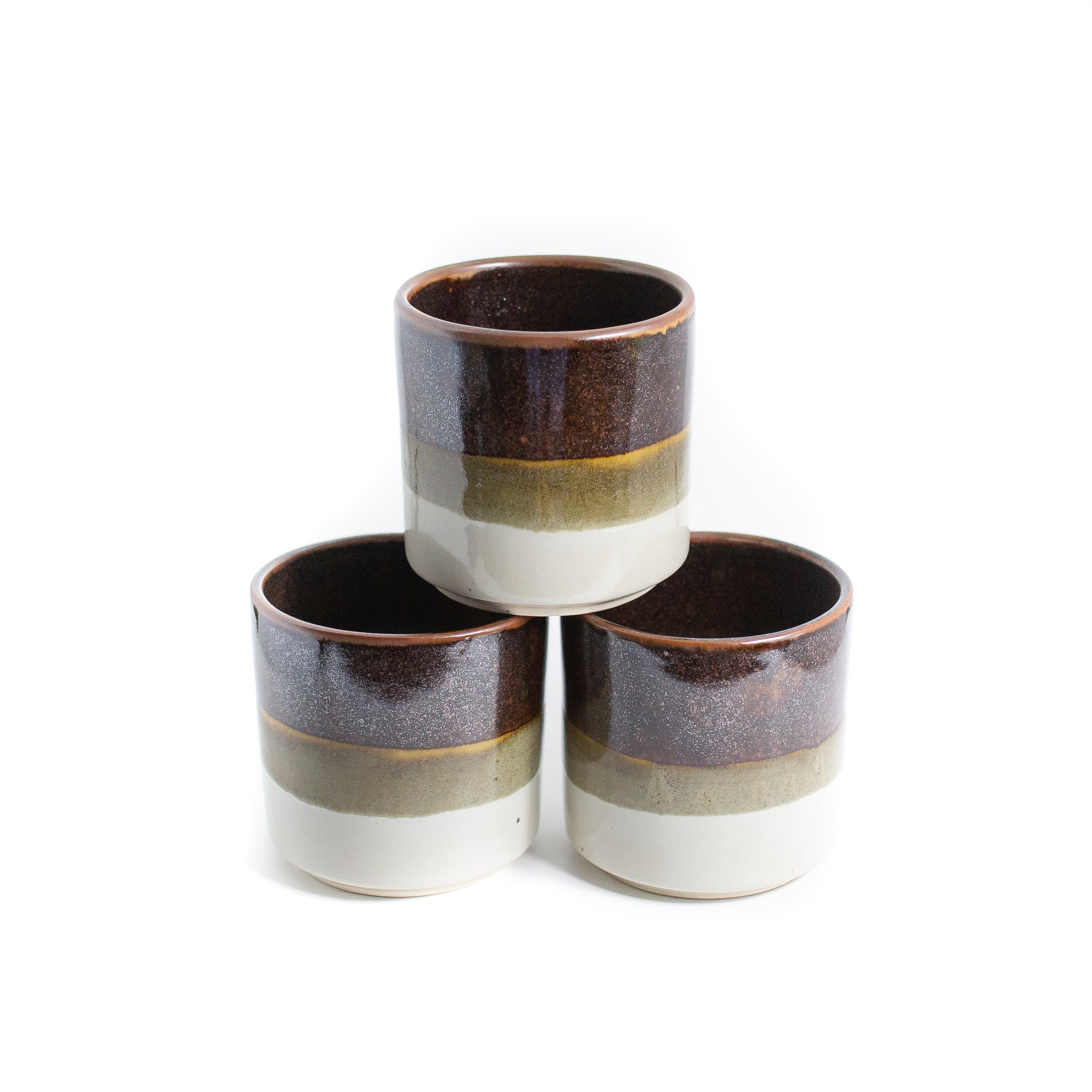 Tricolour planter pots on white background 